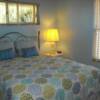 The guest bedroom has a queen size bed.